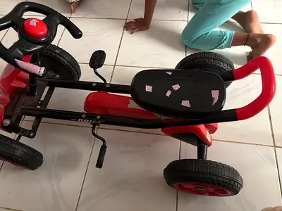 Red and black kids pedal tricycle - used