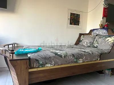 Wooden single bed with headboard and storage drawer - good condition