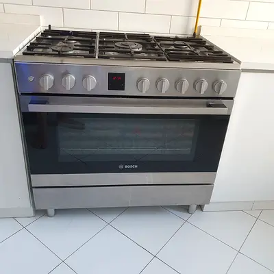 Bosch stainless steel gas cooker with oven - good condition. With oven fan.