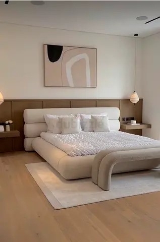 Modern upholstered king size bed with integrated headboard