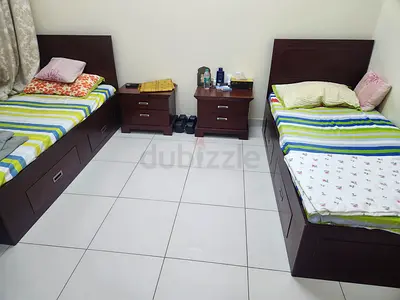Pair of single beds with storage and two matching bedside tables - dark wood