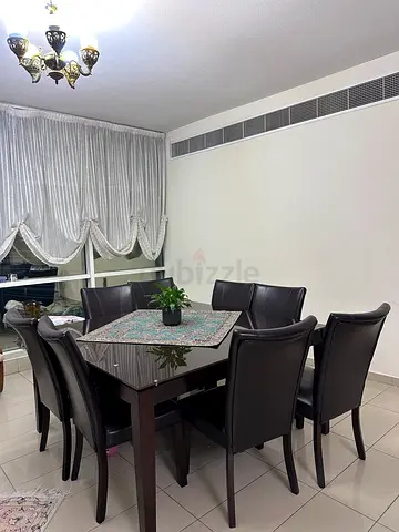 Dining Table with 8 Chairs – AED 35