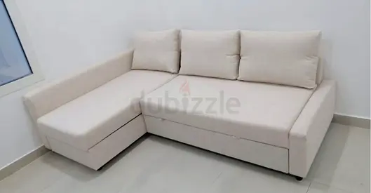 Light beige L-shaped corner sofa bed with storage, good condition