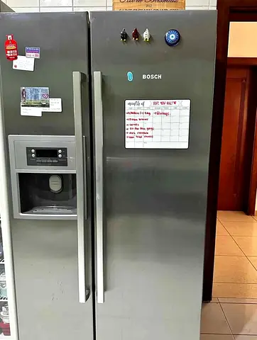 Bosch side by side fridge and freezer new model slightly used with ice maker water dispenser