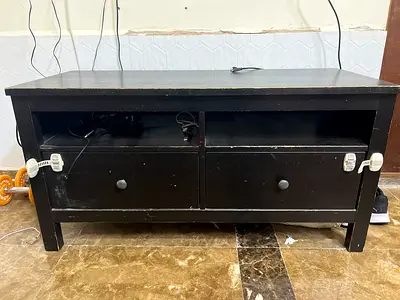 Used black wooden TV stand / media console with drawers
