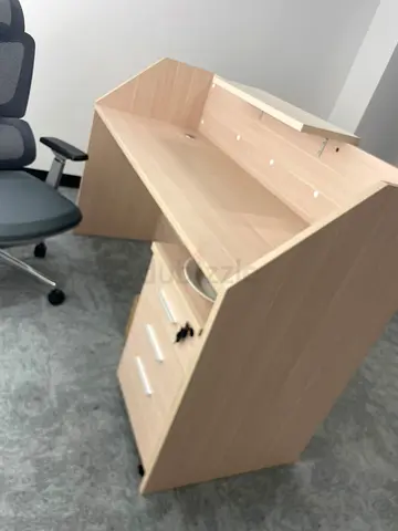 Light wood reception counter/desk with storage drawers — good condition