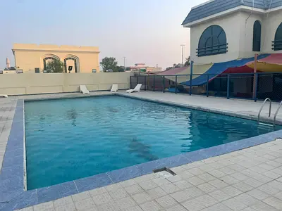 Four-bedroom villa with two living rooms, maid's room, built-in wardrobes, for annual rent in Sharq