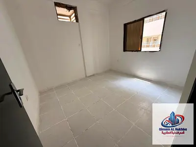 Bachelor share: 1BR+hall in Al Butina near Nesto. Free maintenance, easy access to Dubai and Ajman exits.