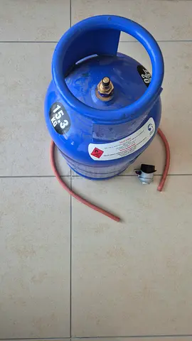 Gas cylinder with regulator and pipe