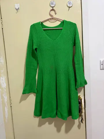 Green ribbed long-sleeve knit top, size likely S
