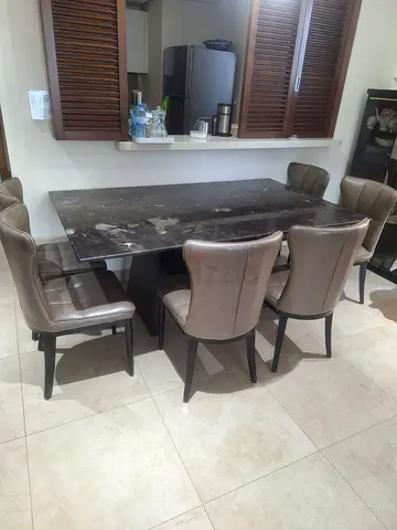 Marble-top dining table with 6 upholstered chairs - good condition