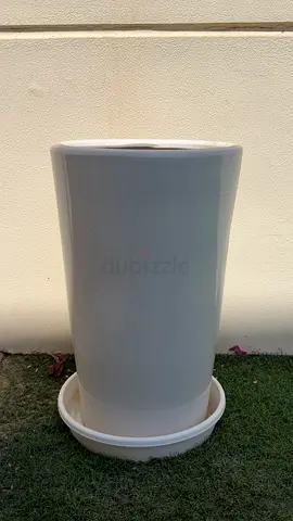 Tall white ceramic planter with saucer