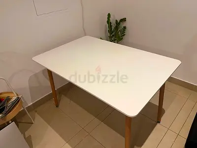 White rectangular dining/work table with wooden legs - good condition