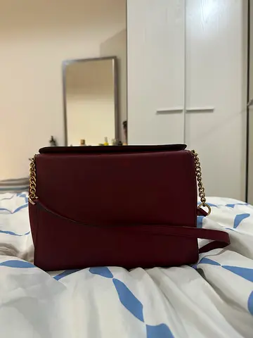 Burgundy leather shoulder bag with chain strap - good condition