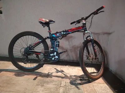 Folding Bike Shard Land Rover، with equipment.