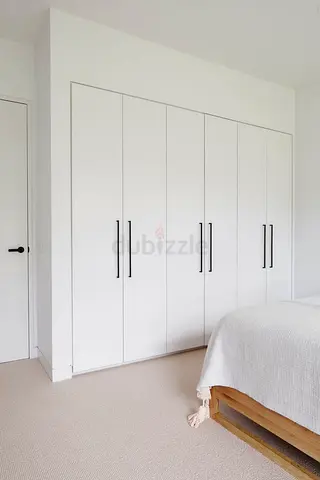 Built-in White Wardrobe with Tall Black Handles - 6 Doors