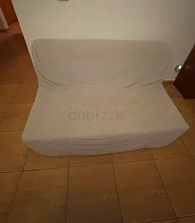 Compact 2-seater beige sofa bed; very good condition