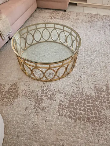 Round glass top metal coffee table with gold finish