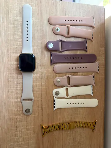 Apple Watch Series 8, 41mm Gold with multiple silicone bands and metal link strap - excellent condit