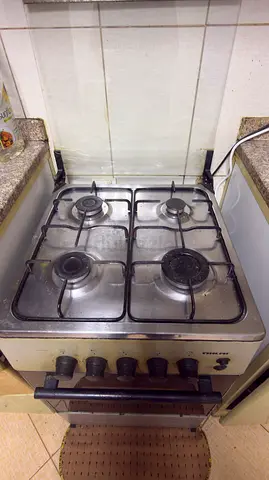Used 4-Burner Gas Stove with Oven - Functional, good condition