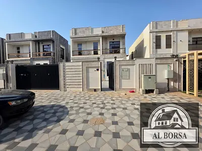 Villa for rent in Al Bahia, Ajman: 5 bedrooms, a majlis, a living room, and a spacious kitchen, plus a maid's room.