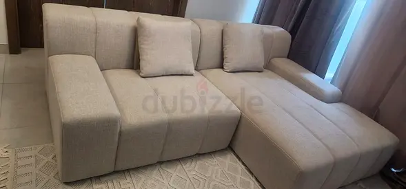 L-shaped sofa,1.5 years old, spotless & new. Left single-seater barely used; larger section on right