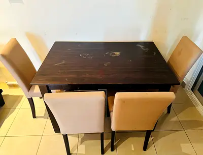 Used dark wood dining table with 4 beige chairs - good for small dining area