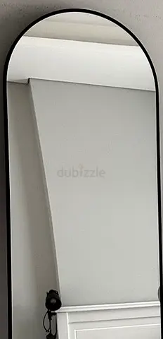Black framed full length arched mirror