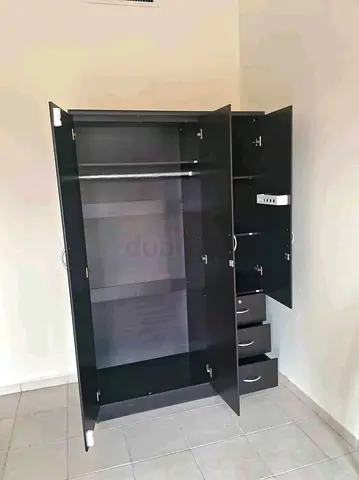 Dark wood 3-door wardrobe with drawers and hanging rail