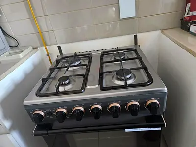 Used 4-Burner Gas Stove with Oven - Stainless Steel