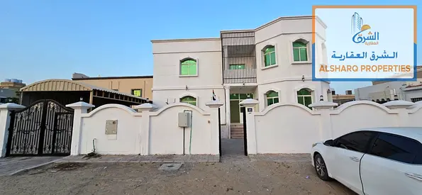 Villa for rent in Al Rawda 1, Ajman, on a paved residential-commercial street. 4,300 sq ft, 8 rooms, majlis, 2 halls and kitchen. Suitable for family
