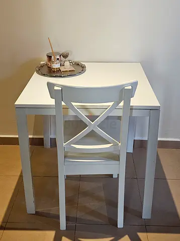 White Ikea table with matching chair