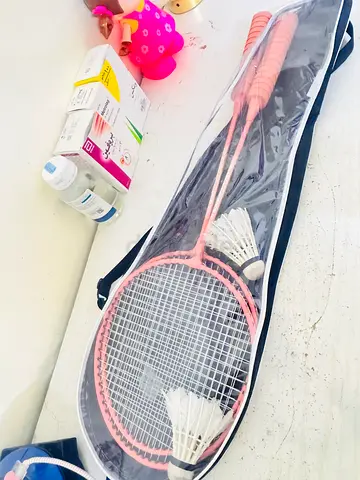 Two pink badminton rackets with cover and shuttlecocks - good condition