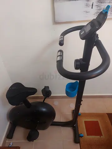 Compact Upright Exercise Bike with Adjustable Seat - Good Condition
