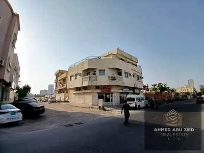 **An excellent investment opportunity in Liwara, Ajman: A two-level property (ground floor plus one upper floor) featuring four 2-bedroom apartments a