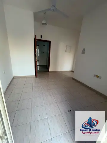 Lowest price for a one-bedroom apartment with a living room and balcony; security deposit via cheque; located in a family-friendly building.