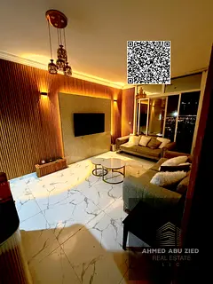 The most beautiful and spacious two-bedroom apartment with a living room in Al Waha Towers, availabl