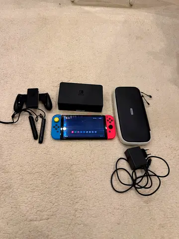 Nintendo switch oled 800 AED and custom joycon it can connect to a tv with original charger