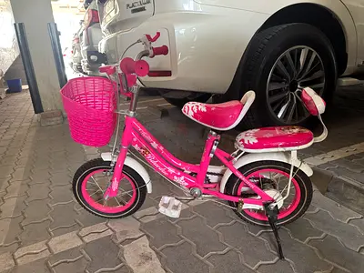 Pink girls' 12-inch bicycle with basket