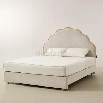 Queen upholstered bed with scallop headboard - light beige