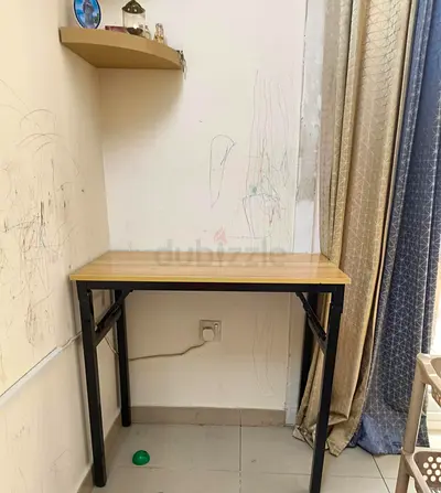 Compact folding study table with wooden top and black metal legs