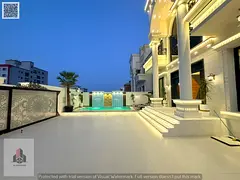 A compact villa in Al Muwaihat featuring 5 bedrooms and a rooftop terrace; conveniently located near