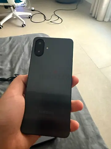 Black smartphone with dual rear cameras, in good condition. Used for only 1 week. With phone case