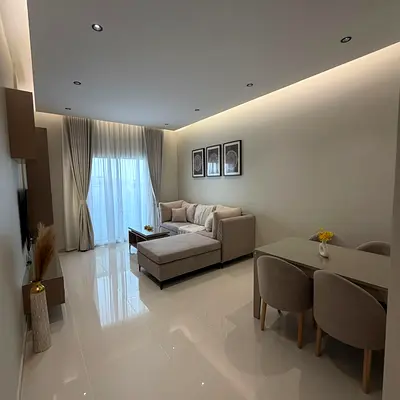 A luxurious, high-end, fully furnished "super deluxe" one-bedroom apartment (with living room) for monthly rent in Ajman ✔️ Bills & internet included.