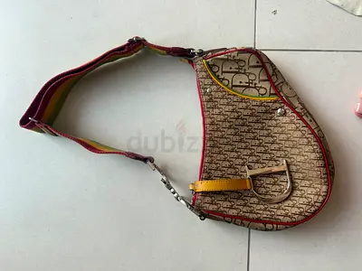 Pre-owned vintage Dior saddle shoulder bag with rainbow strap Galliano Rasta collection very rare