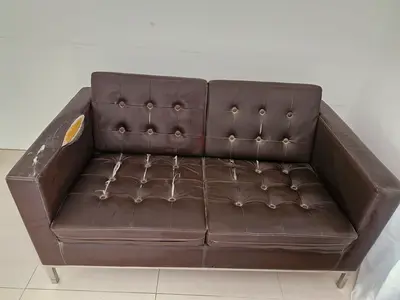 2-seater brown faux leather sofa - used, needs repair