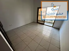 Spacious one-bedroom apartment with a living room, featuring central air conditioning and built-in w