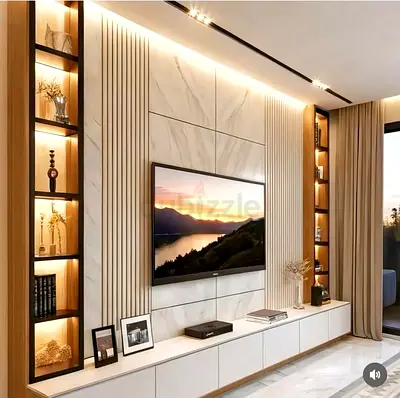 Modern built-in TV entertainment unit with marble panels and illuminated shelves