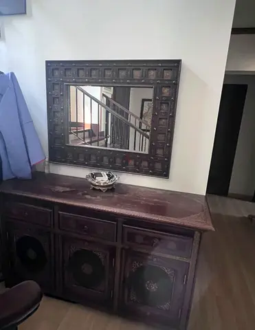 Dark carved wooden sideboard with matching wall mirror - solid vintage style