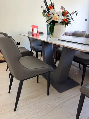 8-seater modern marble top dining table with upholstered chairs